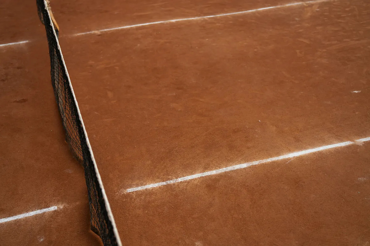 Tennis racket on a court in Delhi illustrating tennis event categories